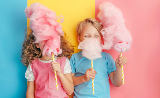 Older couple enjoying cotton candy at a fair