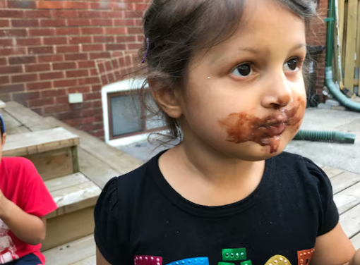 Child with dessert cup